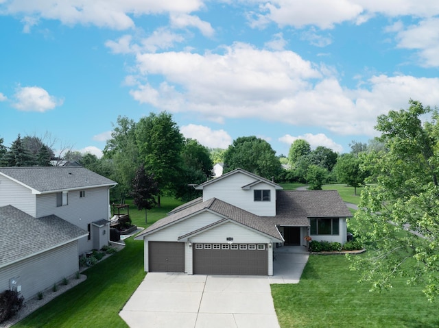 4619 Heather Way N, Oakdale, MN 55128 - traditional-style house featuring a garage, concrete driveway, a front yard, and roof with shingles