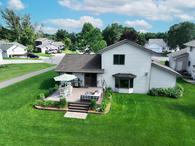 4619 Heather Way N, Oakdale, MN 55128 - rear view of property featuring a deck, a lawn, a residential view, and roof with shingles
