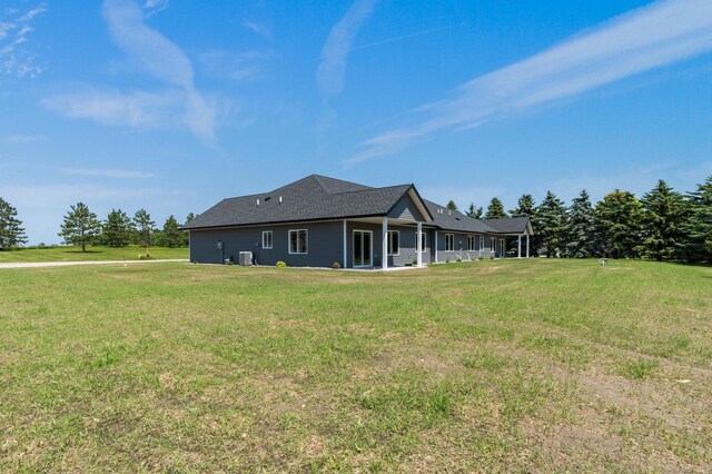 607 Colfax St, Parkers Prairie, MN 56361 - back of house featuring a lawn