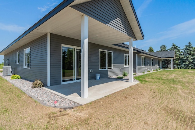 607 Colfax St, Parkers Prairie, MN 56361 - back of property with a patio area and a yard