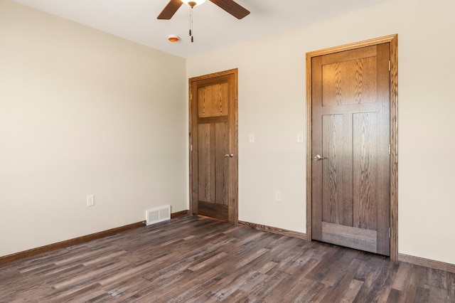 607 Colfax St, Parkers Prairie, MN 56361 - unfurnished bedroom featuring dark wood-style flooring and ceiling fan