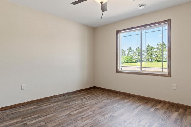 607 Colfax St, Parkers Prairie, MN 56361 - unfurnished room featuring wood finished floors, a ceiling fan, and a smoke detector