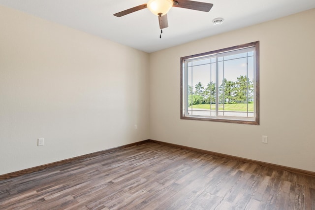 607 Colfax St, Parkers Prairie, MN 56361 - unfurnished room with wood finished floors, a ceiling fan, and a smoke detector