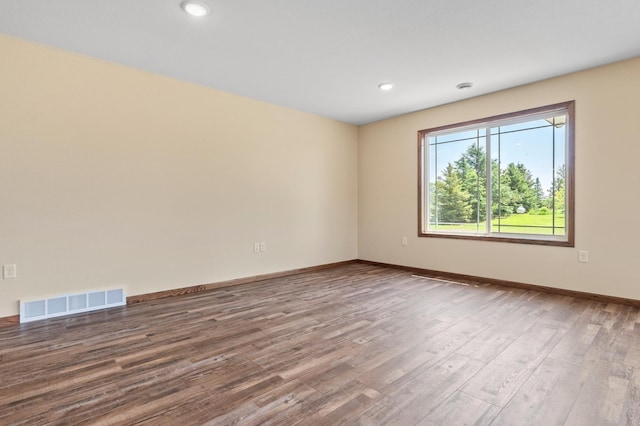 607 Colfax St, Parkers Prairie, MN 56361 - unfurnished room with wood finished floors and recessed lighting