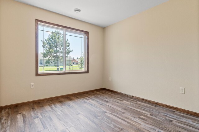 607 Colfax St, Parkers Prairie, MN 56361 - empty room with wood finished floors and baseboards
