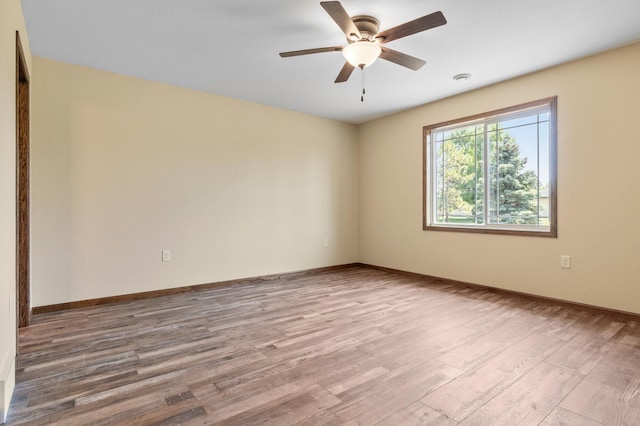 607 Colfax St, Parkers Prairie, MN 56361 - spare room featuring wood finished floors and ceiling fan