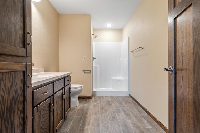 607 Colfax St, Parkers Prairie, MN 56361 - full bath with wood finished floors, a shower, and vanity