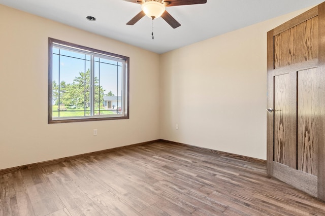 607 Colfax St, Parkers Prairie, MN 56361 - unfurnished room with wood finished floors and ceiling fan