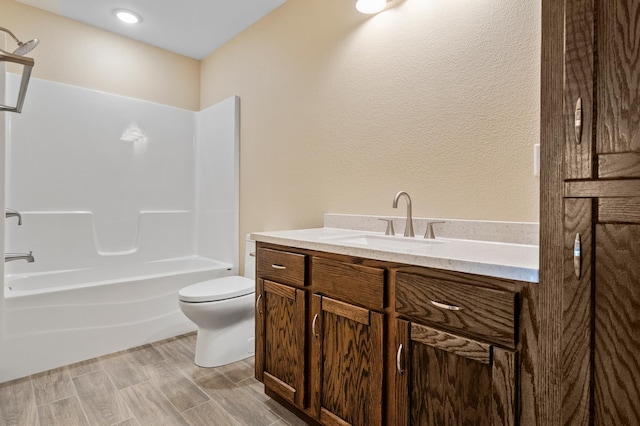 607 Colfax St, Parkers Prairie, MN 56361 - bathroom featuring vanity, shower / washtub combination, and a textured wall
