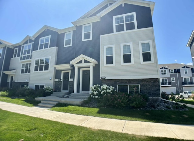 7628 Carla Path, Inver Grove Heights, MN 55076 - townhome / multi-family property with a front lawn and stone siding