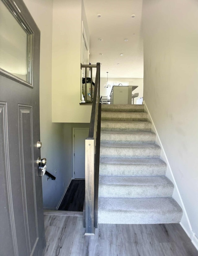 7628 Carla Path, Inver Grove Heights, MN 55076 - staircase featuring wood finished floors and baseboards