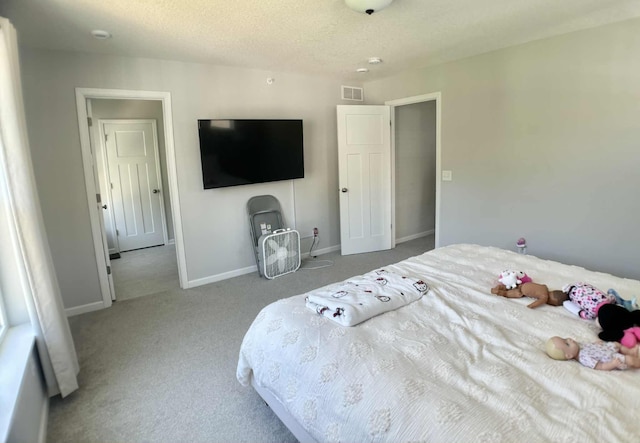 7628 Carla Path, Inver Grove Heights, MN 55076 - bedroom with carpet flooring and a textured ceiling