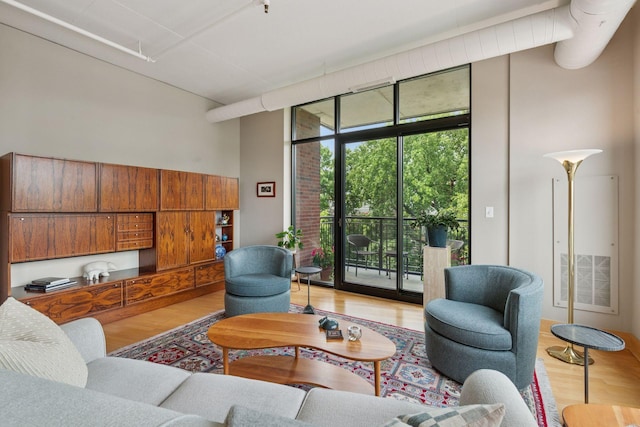 150 2nd St NE Unit B302, Minneapolis, MN 55413 - living area featuring wood finished floors and expansive windows