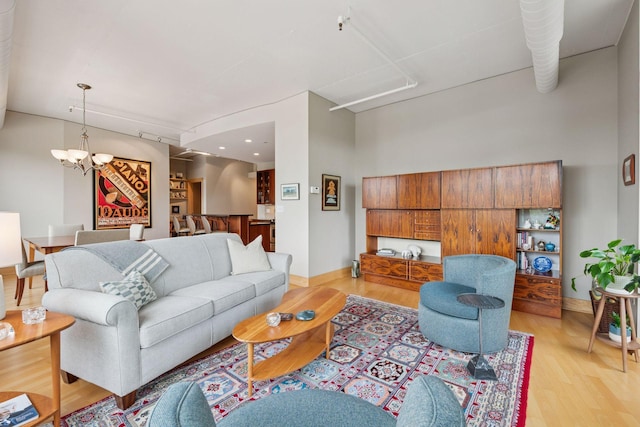 150 2nd St NE Unit B302, Minneapolis, MN 55413 - living room featuring a chandelier, light wood-style floors, and recessed lighting