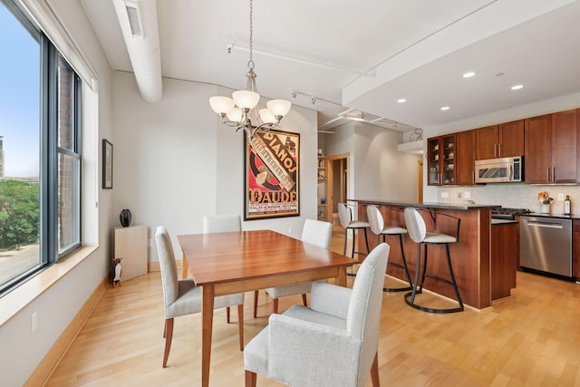 150 2nd St NE Unit B302, Minneapolis, MN 55413 - dining area featuring plenty of natural light, light wood-style flooring, a chandelier, and recessed lighting