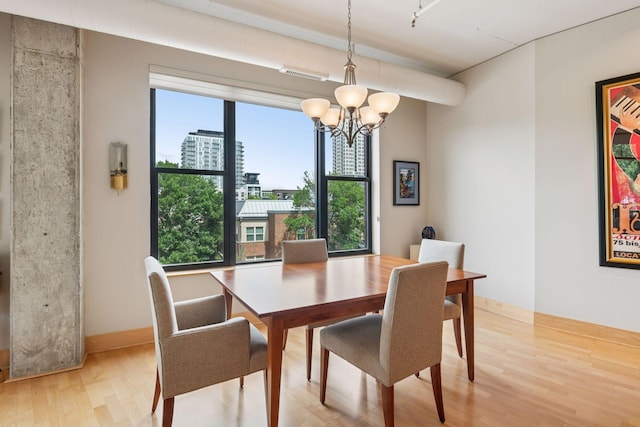 150 2nd St NE Unit B302, Minneapolis, MN 55413 - dining space with a chandelier and light wood-style flooring