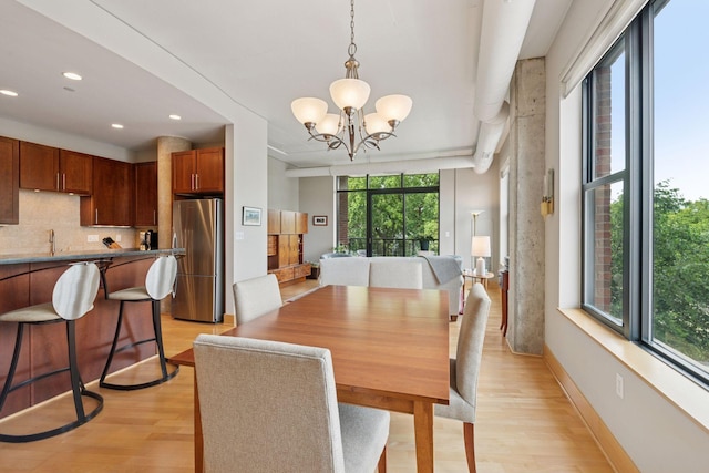 150 2nd St NE Unit B302, Minneapolis, MN 55413 - dining room with light wood-style floors, a chandelier, and recessed lighting