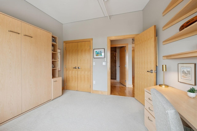 150 2nd St NE Unit B302, Minneapolis, MN 55413 - bedroom with attic access, light carpet, and a desk