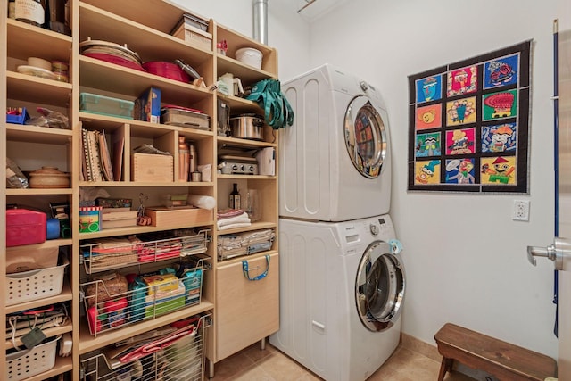 150 2nd St NE Unit B302, Minneapolis, MN 55413 - laundry area with stacked washer / dryer and light tile patterned flooring