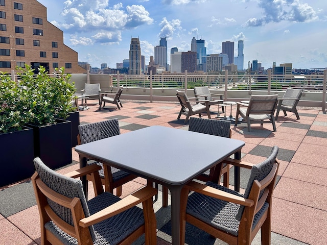 150 2nd St NE Unit B302, Minneapolis, MN 55413 - view of patio / terrace featuring outdoor dining area and a view of skyline