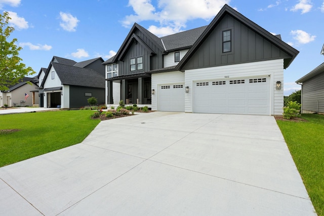 9612 Iron Horse Rd, Woodbury, MN 55129 - view of front of house with board and batten siding, a front lawn, concrete driveway, and a garage