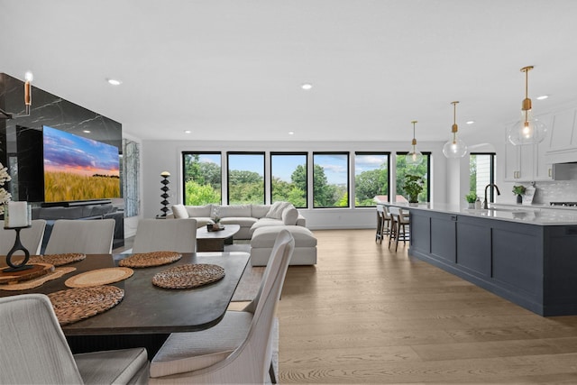 9612 Iron Horse Rd, Woodbury, MN 55129 - dining room with light wood-style floors and recessed lighting