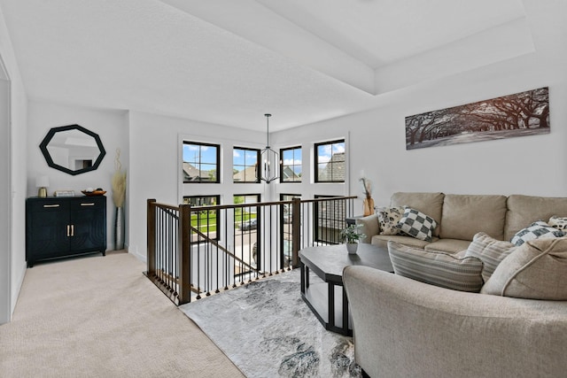 9612 Iron Horse Rd, Woodbury, MN 55129 - living room featuring light colored carpet and a chandelier