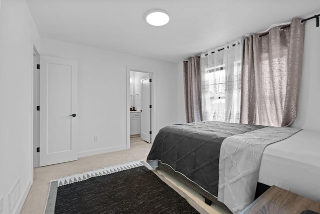 9612 Iron Horse Rd, Woodbury, MN 55129 - carpeted bedroom featuring baseboards and connected bathroom