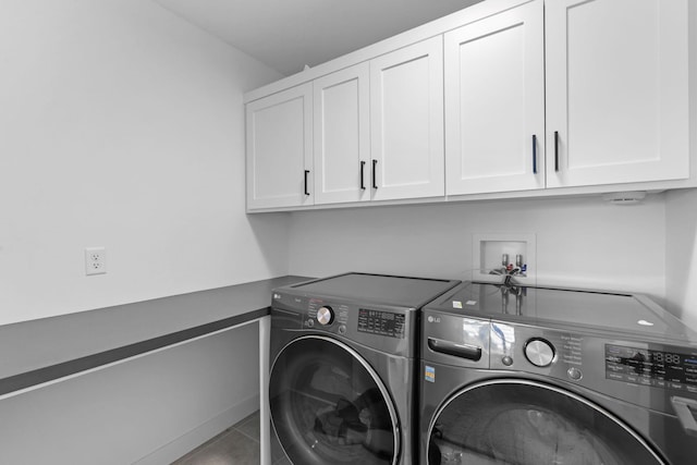 9612 Iron Horse Rd, Woodbury, MN 55129 - washroom with independent washer and dryer, cabinet space, and tile patterned floors
