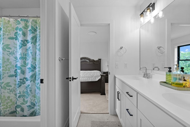 9612 Iron Horse Rd, Woodbury, MN 55129 - full bathroom featuring connected bathroom, double vanity, and tile patterned floors