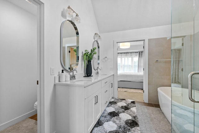 9612 Iron Horse Rd, Woodbury, MN 55129 - bathroom with double vanity, a freestanding bath, lofted ceiling, a shower with door, and tile patterned floors