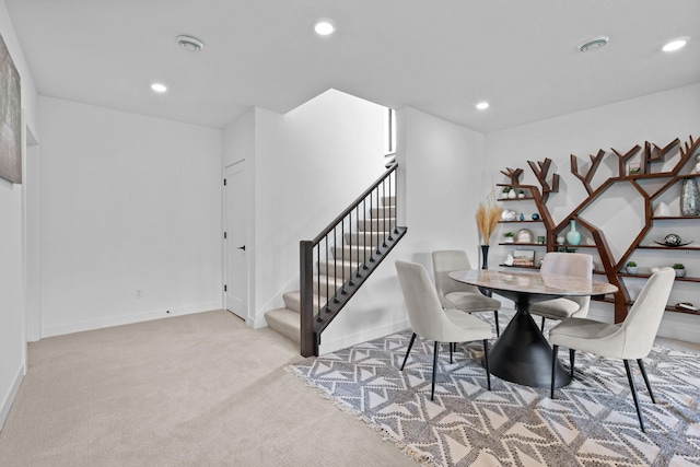 9612 Iron Horse Rd, Woodbury, MN 55129 - carpeted dining space featuring stairs and recessed lighting