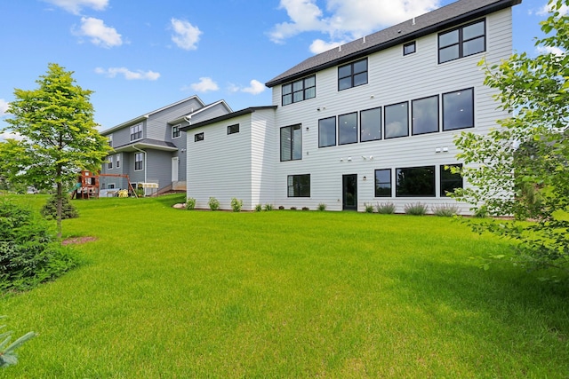 9612 Iron Horse Rd, Woodbury, MN 55129 - rear view of house with a yard
