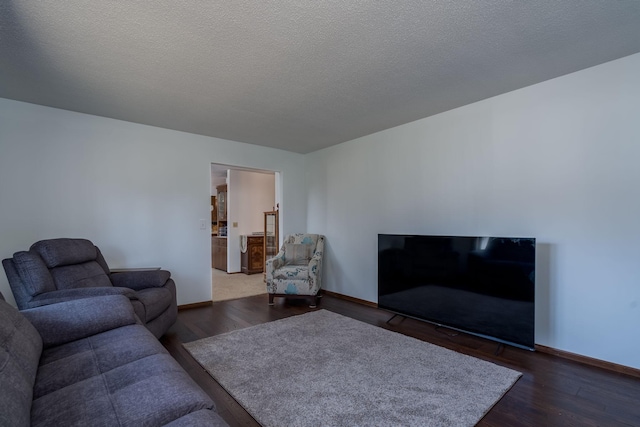 301 Nottingham Ct, North Mankato, MN 56003 - living room featuring dark wood-style flooring and a textured ceiling