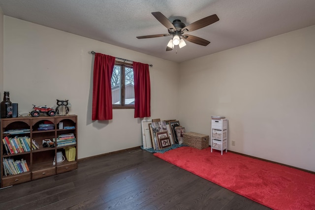 301 Nottingham Ct, North Mankato, MN 56003 - misc room with wood finished floors, a ceiling fan, and a textured ceiling