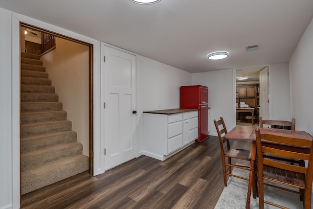 301 Nottingham Ct, North Mankato, MN 56003 - dining space featuring dark wood-type flooring and stairs