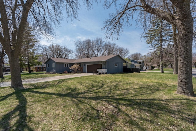 301 Nottingham Ct, North Mankato, MN 56003 - view of front of property featuring a garage, driveway, board and batten siding, and a front yard