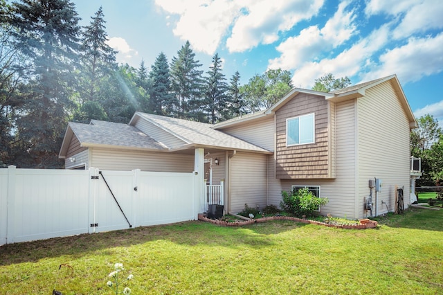 307 Hayden Lake Rd W, Champlin, MN 55316 - split level home featuring a gate and roof with shingles