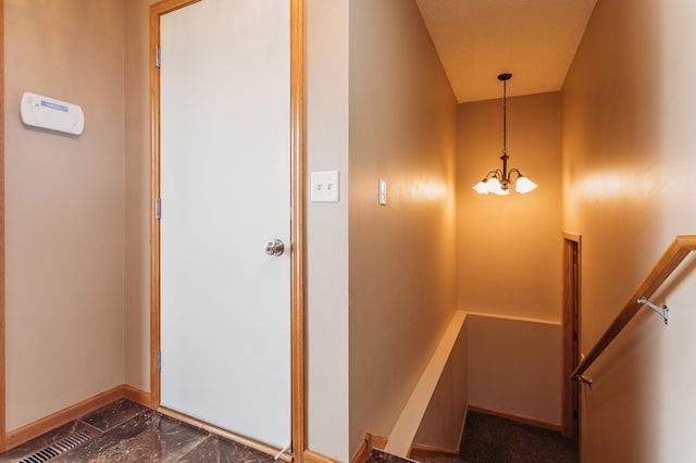 307 Hayden Lake Rd W, Champlin, MN 55316 - stairs featuring a chandelier and baseboards