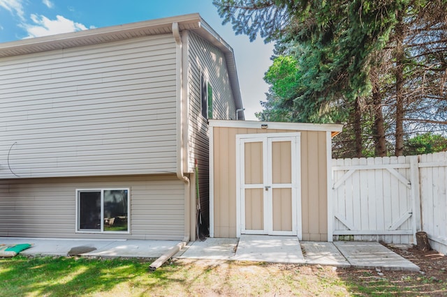 307 Hayden Lake Rd W, Champlin, MN 55316 - rear view of property with a storage shed