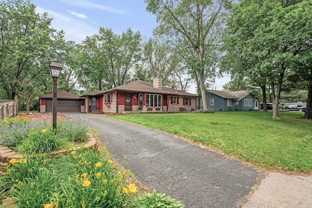 11542 Xavis St NW, Coon Rapids, MN 55433 - single story home featuring a front lawn, a chimney, and an outbuilding