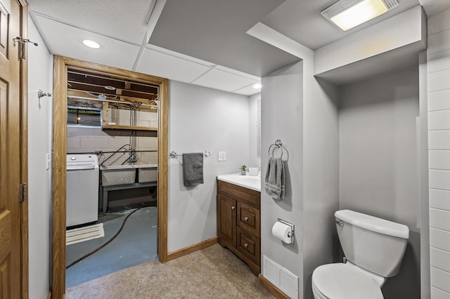 11542 Xavis St NW, Coon Rapids, MN 55433 - bathroom with vanity, recessed lighting, and washer / dryer