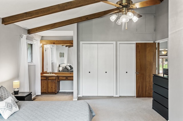 11542 Xavis St NW, Coon Rapids, MN 55433 - bedroom featuring two closets, carpet flooring, and beam ceiling