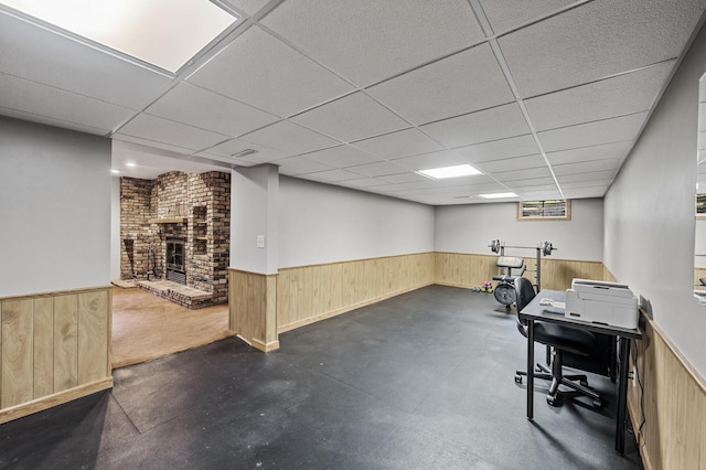 11542 Xavis St NW, Coon Rapids, MN 55433 - office space featuring wainscoting, a paneled ceiling, wooden walls, a brick fireplace, and concrete flooring