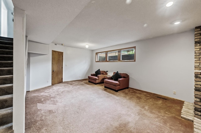 11542 Xavis St NW, Coon Rapids, MN 55433 - living area with carpet, stairway, a textured ceiling, and recessed lighting