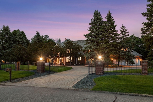 10 Apple Orchard Ct, Dellwood, MN 55110 - view of property hidden behind natural elements featuring curved driveway and a fenced front yard