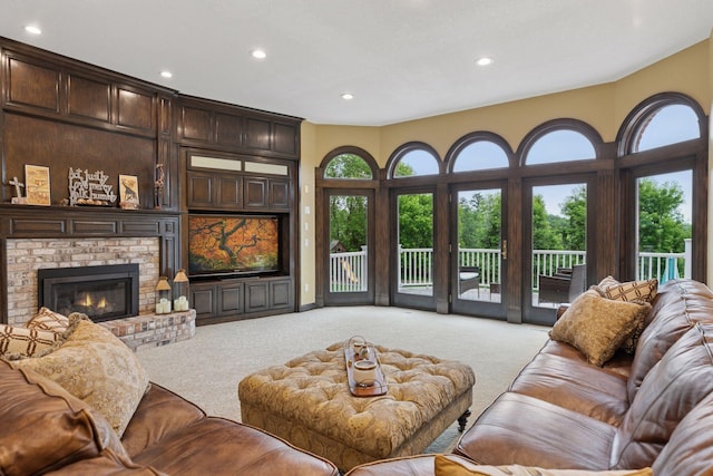 10 Apple Orchard Ct, Dellwood, MN 55110 - living area with light colored carpet, recessed lighting, and a brick fireplace
