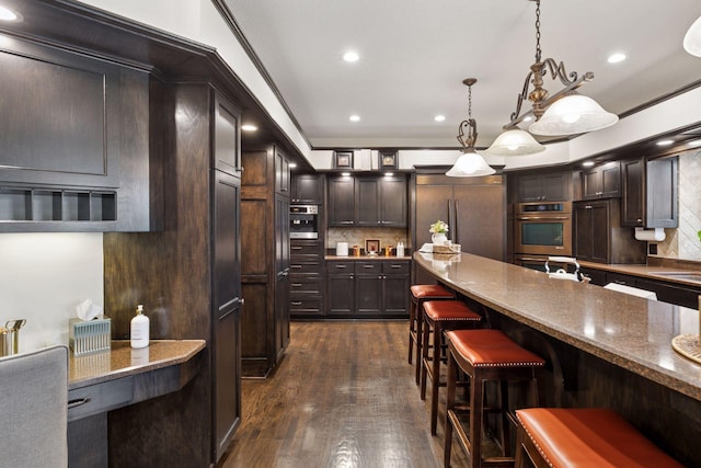 10 Apple Orchard Ct, Dellwood, MN 55110 - kitchen featuring double oven, paneled built in refrigerator, backsplash, dark brown cabinets, and recessed lighting