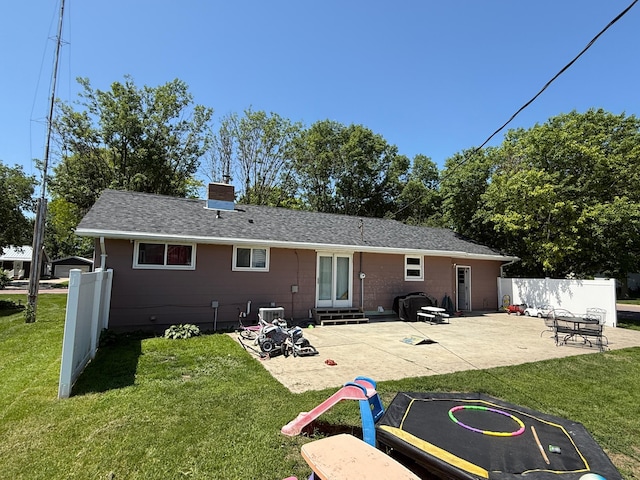 122 3rd St E, Morgan, MN 56266 - back of house with entry steps, a patio area, a chimney, and roof with shingles