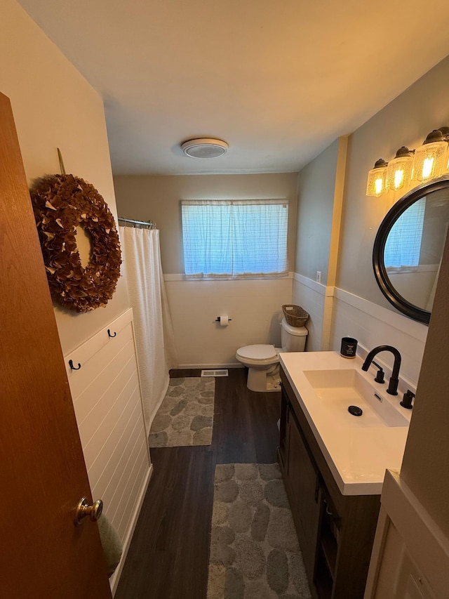 122 3rd St E, Morgan, MN 56266 - bathroom featuring wood finished floors, vanity, and curtained shower